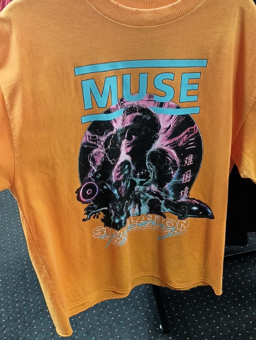 Muse Graphic Tee in Orange with Teal and Neon Pink Print